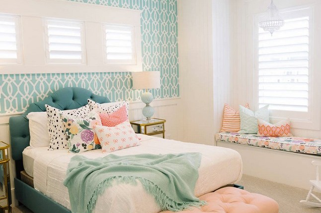 Are you a fan of the colors used in this bedroom? The peach and blue hues compli…