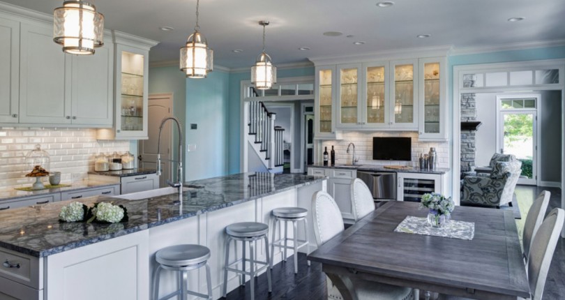 Do you like the color combination of whites, grays and blues in this kitchen?…