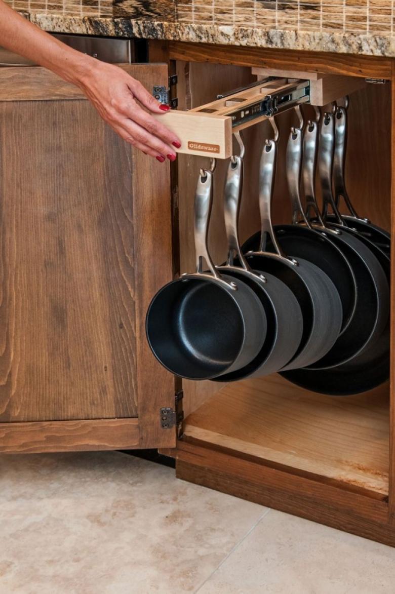 This sliding hanger keeps all of your pots and pans organized, plus stores them …
