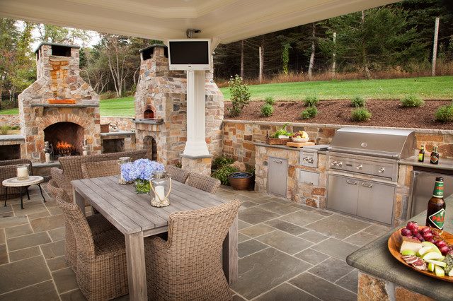 This perfect covered outdoor kitchen and patio space is great for entertaining d…