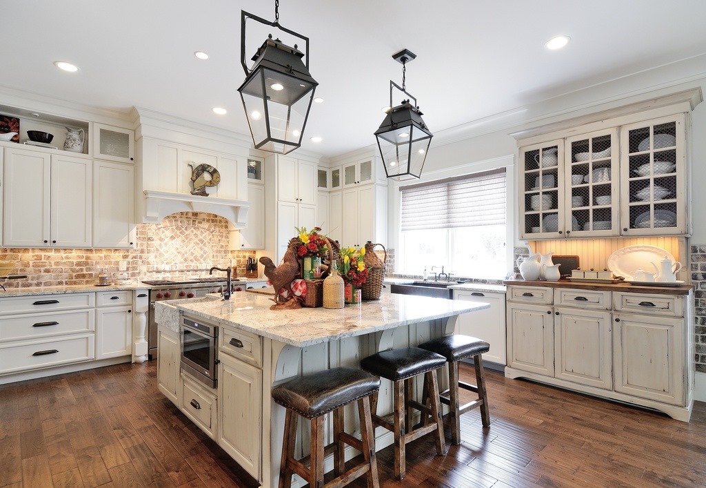 Are you a fan of this bright and open kitchen space?…