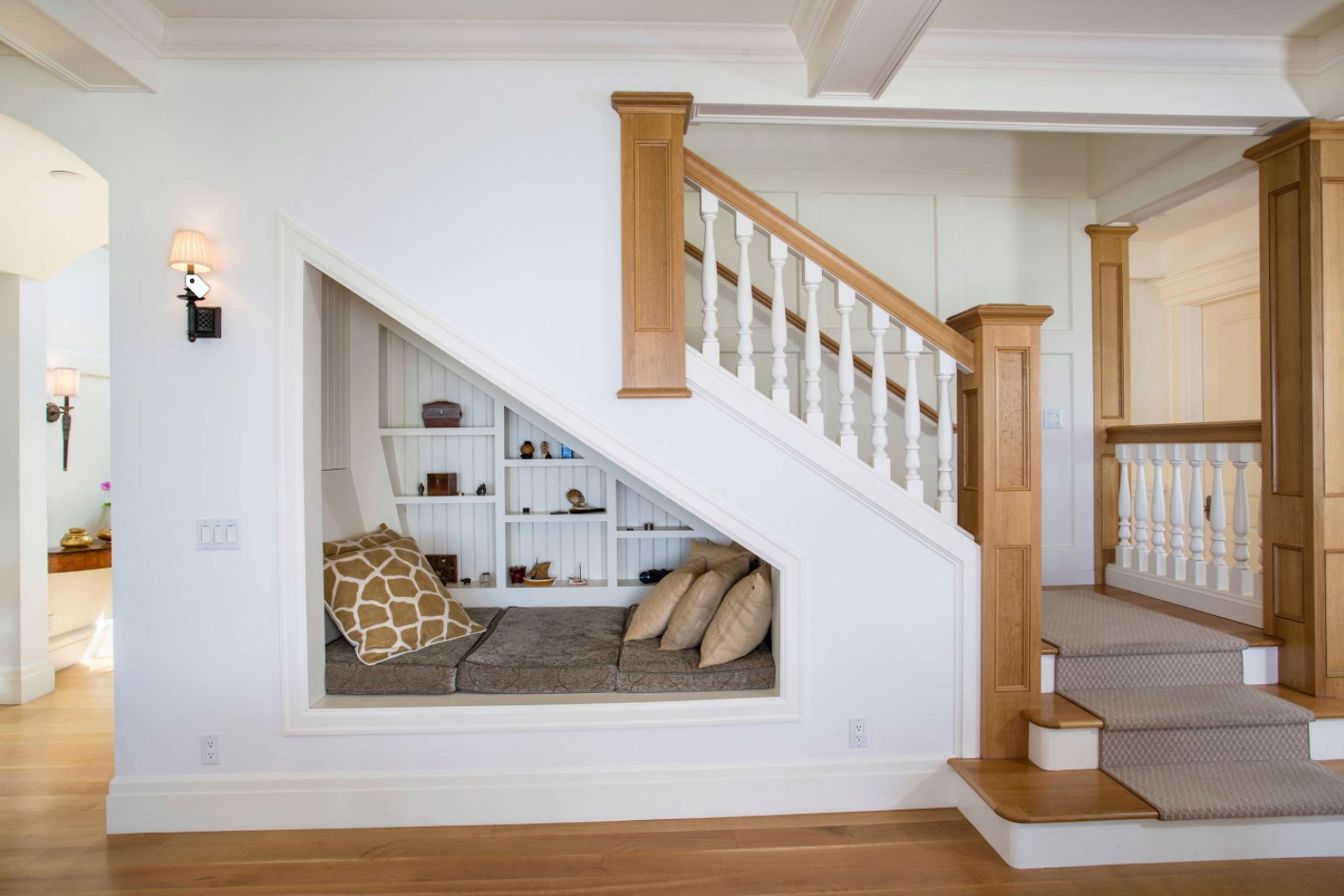 The owners of this home used the space under their stairs to add a napping nook …