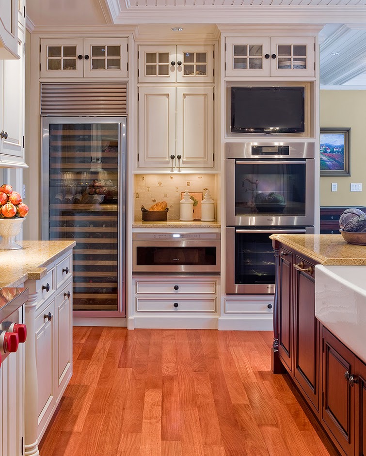 This kitchen has all of the top appliances, including double ovens and a large w…