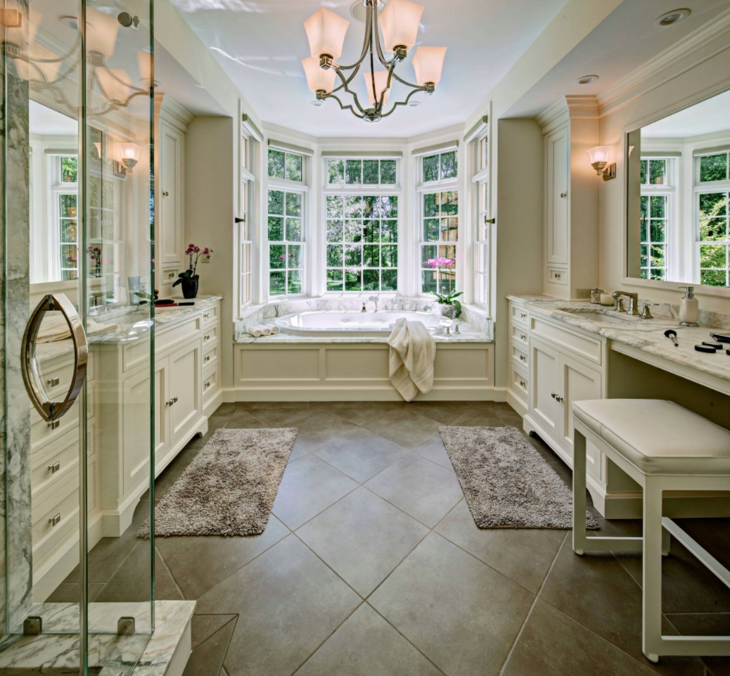 Are you a fan of this elegant master bathroom? We love how HUGE it is! You’d nev…