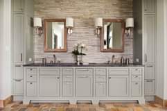 This custom bathroom vanity has a TON of cabinets and drawers! What do you think…