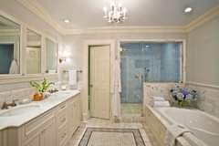 The blue shower tile in this white bathroom adds just the right pop! Would you g…