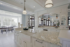 The countertops in this kitchen are made of recycled glass!…